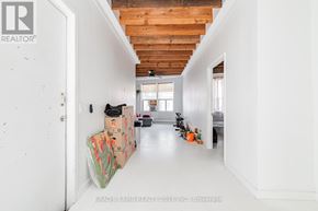 Toronto (Little Portugal) apartment for rent - A long white hallway with boxes on the floor.