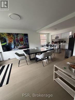 Toronto (Lawrence Park South) apartment for rent - A modern kitchen with a dining table set up.