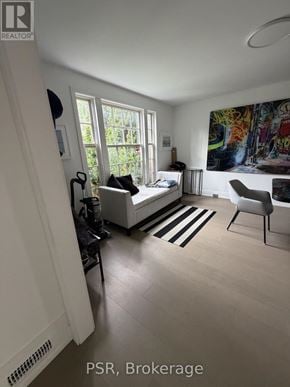Toronto (Lawrence Park South) apartment for rent - A living room with a couch, chair, and a painting on the wall.