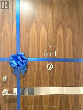 Toronto (Bayview Village) condo for rent - A door with a blue ribbon and a bow on it.