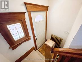 Toronto (Danforth Village-East York) apartment for rent - A white door is in a room with a window above it.