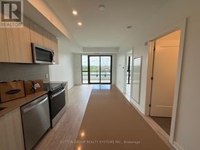 Milton (Cb Cobban) condo for rent - A kitchen with a microwave and oven built into the cabinetry.