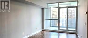 Toronto (Lansing-Westgate) condo for rent - A room with a large window and a sign that says REALTOR.
