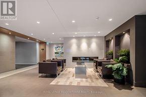 Milton (Fo Ford) condo for rent - A modern waiting area with a reception desk and comfortable seating.