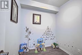 Toronto (Islington-City Centre West) condo for rent - A child's room with a toy robot and a toy car on the floor.