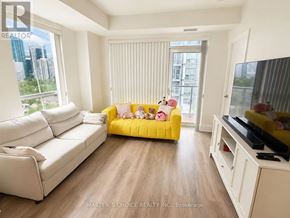 Toronto (Willowdale East) condo for rent - A bedroom with a white bed, a white dresser, and a window overlooking a grassy area.