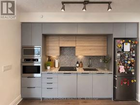 Toronto (Willowdale East) condo for rent - A pool in a room with a wooden wall and a glass door.