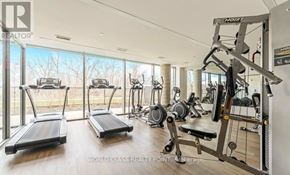 Burlington (Orchard) condo for rent - A well-equipped home gym with treadmills, exercise bikes, and weight machines.