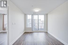 Markham (Unionville) condo for rent - A spacious room with a view of the city through the windows.