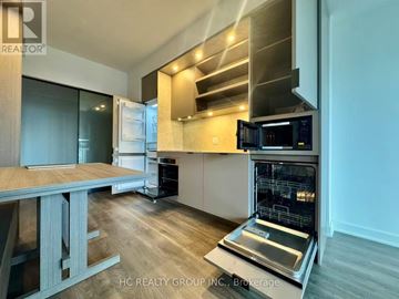 Toronto (Church-Yonge Corridor) condo for rent - A modern kitchen with a stainless steel oven and microwave.