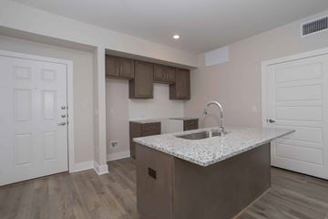 Ponder apartment for rent - A kitchen with a sink and a counter.