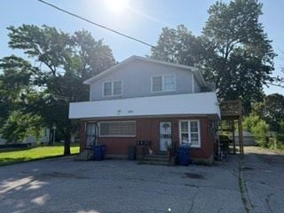 Louisville apartment for rent - A house with a red brick exterior and a white roof.