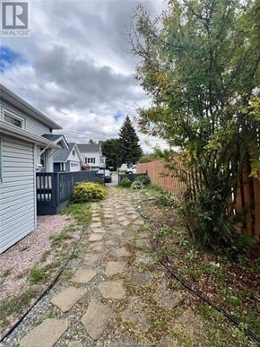Sudbury apartment for rent - A residential area with a stone pathway leading to a house.