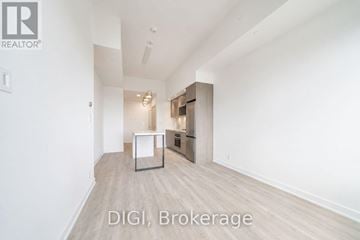 Toronto (Weston-Pellam Park) condo for rent - A room with a kitchenette and a refrigerator in it.