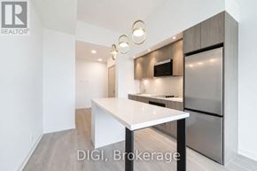 Toronto (Weston-Pellam Park) condo for rent - A modern kitchen with a white countertop and stainless steel appliances.