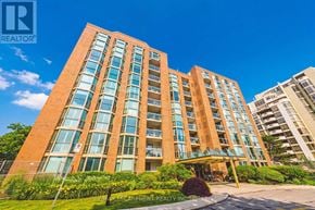 Burlington (Brant) condo for rent - A tall building with a sign that says RE/MAX ESCARMENT REALTY INCORPORATED in front of it.
