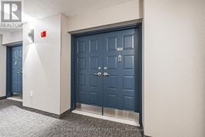 Burlington (Brant) condo for rent - A blue door with a silver handle and a small window above it.