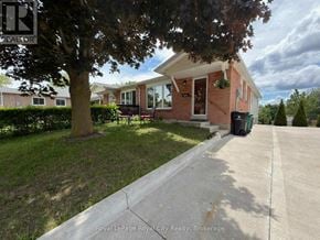 Cambridge apartment for rent - A house with a Royal LePage sign in front of it.