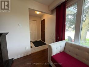 Cambridge apartment for rent - A room with a white sofa and a black mat on the floor.