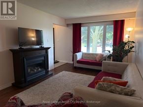 Cambridge apartment for rent - A living room with a fireplace and a couch.