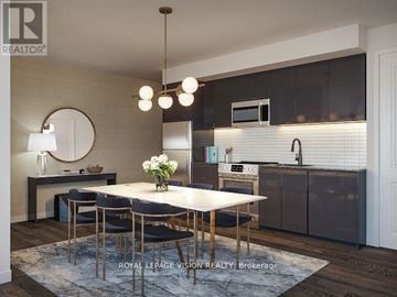 Toronto (Humber Heights) condo for rent - A modern kitchen with a dining table set for four.