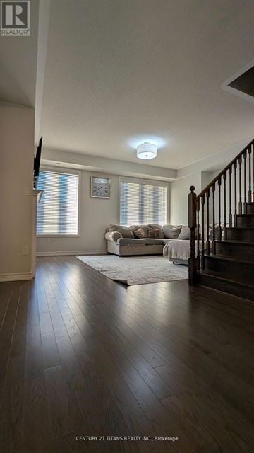 Whitby (Brooklin) townhouse for rent - A living room with a couch and a rug.