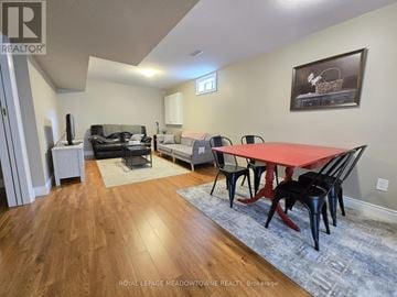 Uxbridge apartment for rent - A living room with a red table and chairs.