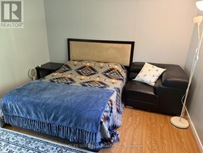 Oro-Medonte apartment for rent - A bedroom with a bed and a couch.