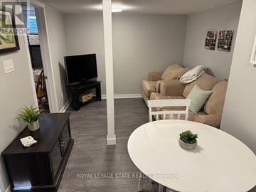 Hamilton (Ancaster) duplex for rent - A living room with a white couch and a television.