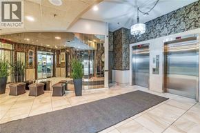 Sarnia condo for rent - A lobby with a Realtor sign on the wall.