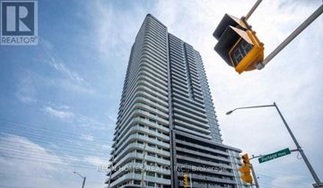 Vaughan (Concord) condo for rent - A tall building with many windows is under construction.
