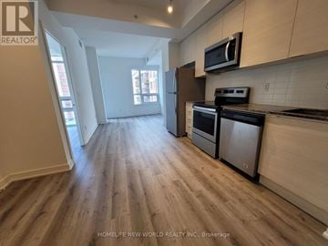 Toronto (Bayview Village) condo for rent - A kitchen with wooden floors and stainless steel appliances.