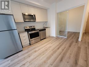 Toronto (Bayview Village) condo for rent - A kitchen with a refrigerator, microwave, oven, and sink.