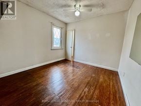 Hamilton (Inch Park) apartment for rent - A room with wooden flooring and a window.