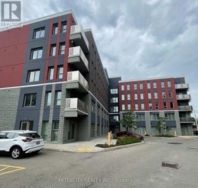Hamilton (Ainslie Wood) condo for rent - A car is parked in a parking lot in front of a building.