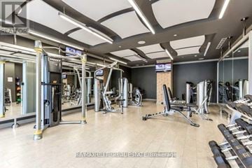 Toronto (Parkwoods-Donalda) condo for rent - A gym with a variety of equipment including treadmills, weights, and exercise machines.