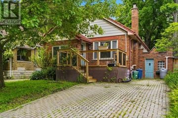 London South (South E) apartment for rent - A house with a brick facade and a wooden deck.