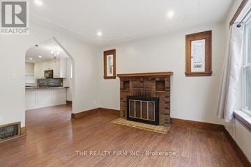London South (South E) apartment for rent - A living room with a fireplace and a painting on the wall.