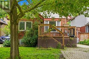 London South (South E) apartment for rent - A house with a deck and a tree in front of it.
