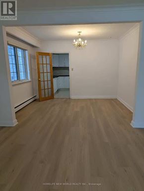 Toronto (Bayview Village) apartment for rent - A room with wooden flooring and a chandelier.