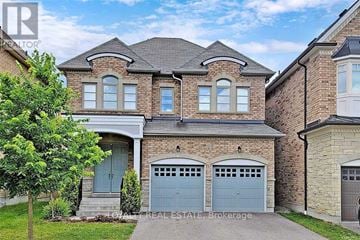 Richmond Hill (Oak Ridges) apartment for rent - A large house with a grey garage door is for sale.
