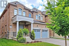 Richmond Hill (Oak Ridges) apartment for rent - A large house with a brick facade and a grey roof.