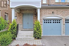 Richmond Hill (Oak Ridges) apartment for rent - A house with a blue front door and garage door.