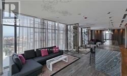 Toronto (Bay Street Corridor) condo for rent - A living room with a grey couch and a coffee table.