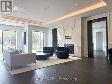 Toronto (Humber Heights) condo for rent - A living room with a white couch and a fireplace.