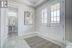 Oakville (Jm Joshua Meadows) apartment for rent - A bathroom with a toilet, sink, and a rug on the floor.