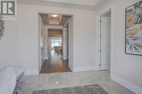 Oakville (Jm Joshua Meadows) apartment for rent - A hallway with a rug on the floor and a painting on the wall.