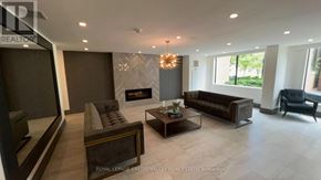 Burlington (Brant) condo for rent - A living room with a fireplace and a couch.