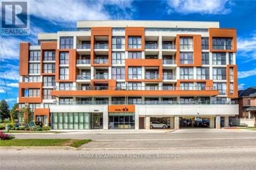 Burlington (Uptown) condo for rent - A multi-story building with a realtor logo on the top left corner.