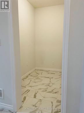 London South (South U) apartment for rent - A room with a marble floor and white walls.